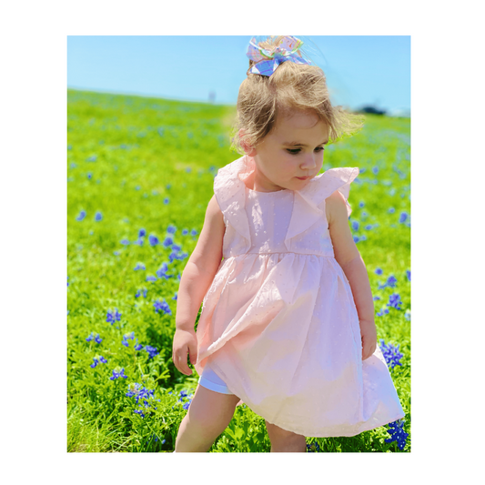 Sweet pink Swiss dot bow-back girl dress by Mabel + Honey.